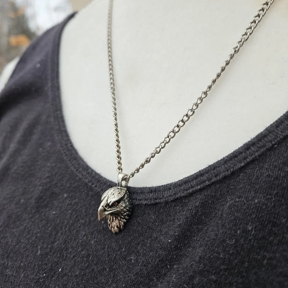 silver tone chain with eagle head pendant